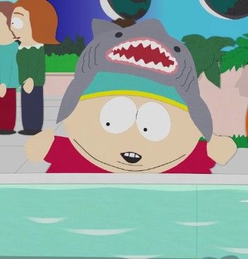 an animated image of a man wearing a shark hat