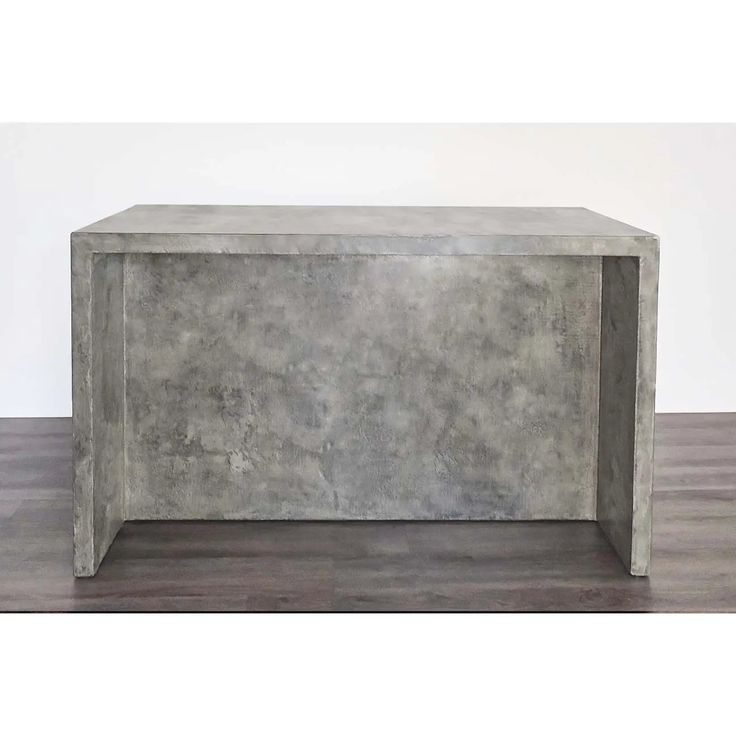 a concrete bench sitting on top of a hard wood floor