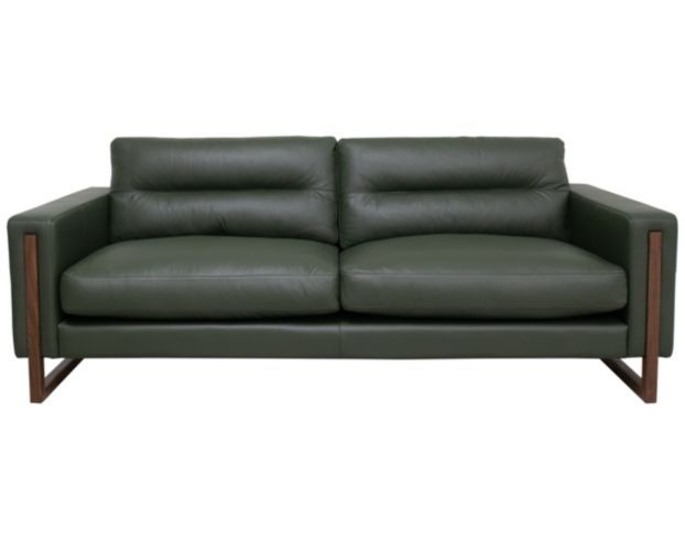 a green leather couch with wooden legs