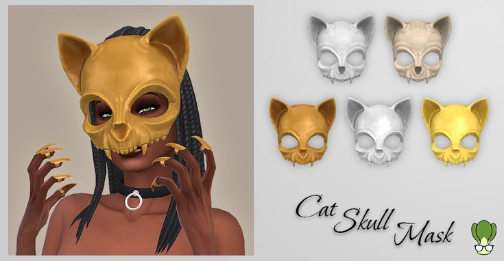 the cat skull mask is made up of gold and silver colored material with black hair