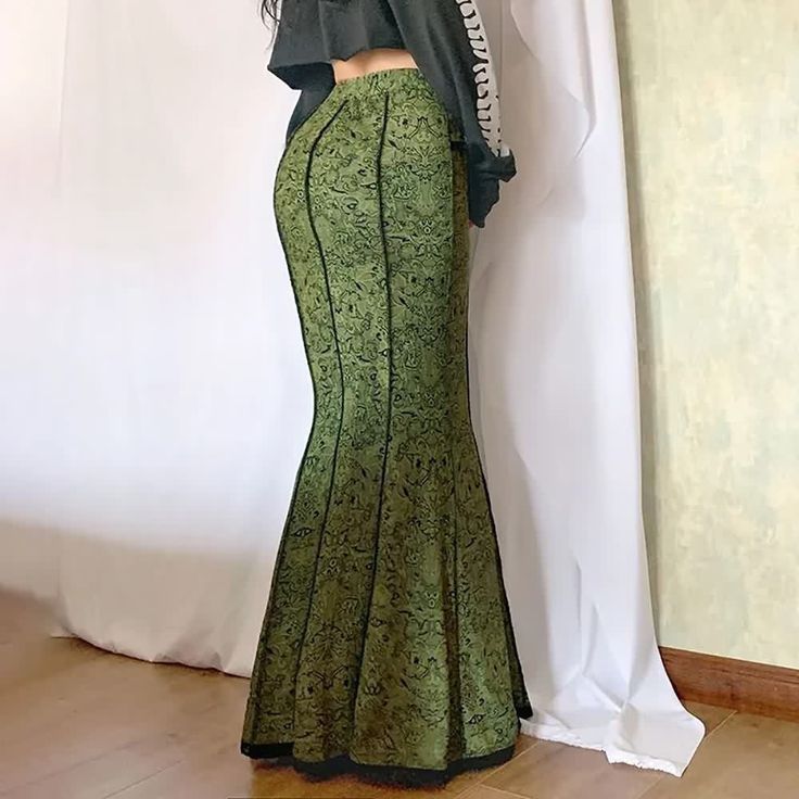 Experience the enchanting allure of our Medieval Gothic Green Maxi Skirt, a unique blend of gothic charm and fairy elegance. This skirt features a mesmerizing mermaid design, accentuated with intricate lace trim that adds a sophisticated touch. The vibrant green artwork infuses this luxurious garment with an extra layer of elegance, making it a standout piece in any wardrobe. Perfect for making a statement at any event, this exclusive skirt is an embodiment of style and mystique. Mesmerizing mer Skirts Aesthetic, Mermaid Skirts, Fitted Maxi Skirt, Green Maxi Skirt, Steampunk Skirt, Estilo Hippie, Long Skirts For Women, Floral Maxi Skirt, Mermaid Skirt