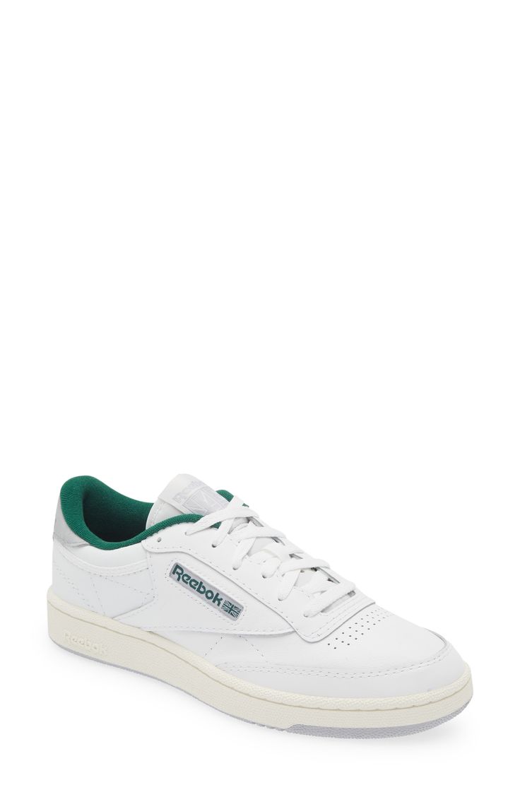 A kicked-up platform sole elevates a fan-favorite court sneaker featuring a layered leather upper and breathable perforations at the toe box. Leather upper/synthetic lining/rubber sole Imported Green Leather High-top Sneakers With Perforated Toe Box, Green Low-top Sneakers With Perforated Toe Box, White High-top Chunky Sneakers With Perforated Toe Box, Classic Leather Basketball Shoes With Perforated Toe Box, Low-top Chunky Sneakers With Perforations For Streetwear, Leather Low-top Basketball Shoes With Textured Sole, Green Leather Sneakers With Perforations, Green Leather Perforated Sneakers, Lace-up Sneakers With Perforations