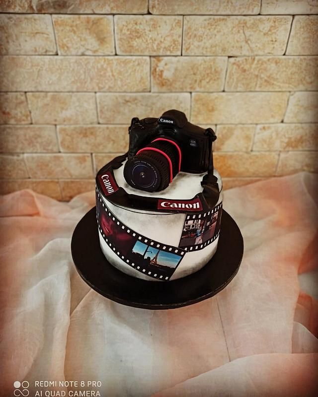 a cake with a camera on top of it