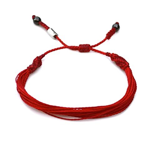 a red string bracelet with two silver beads