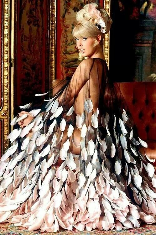 a woman in a dress made out of feathers