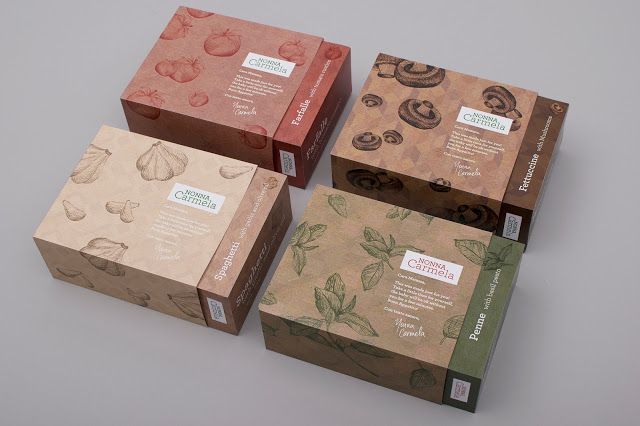 three boxes with different designs on them sitting next to each other, one is brown and one is green