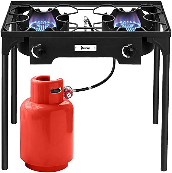 a propane gas stove with an orange fire extinguisher