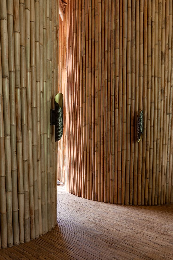 a room with bamboo walls and wooden floors