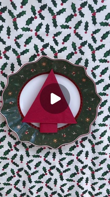 an origami christmas decoration on a plate