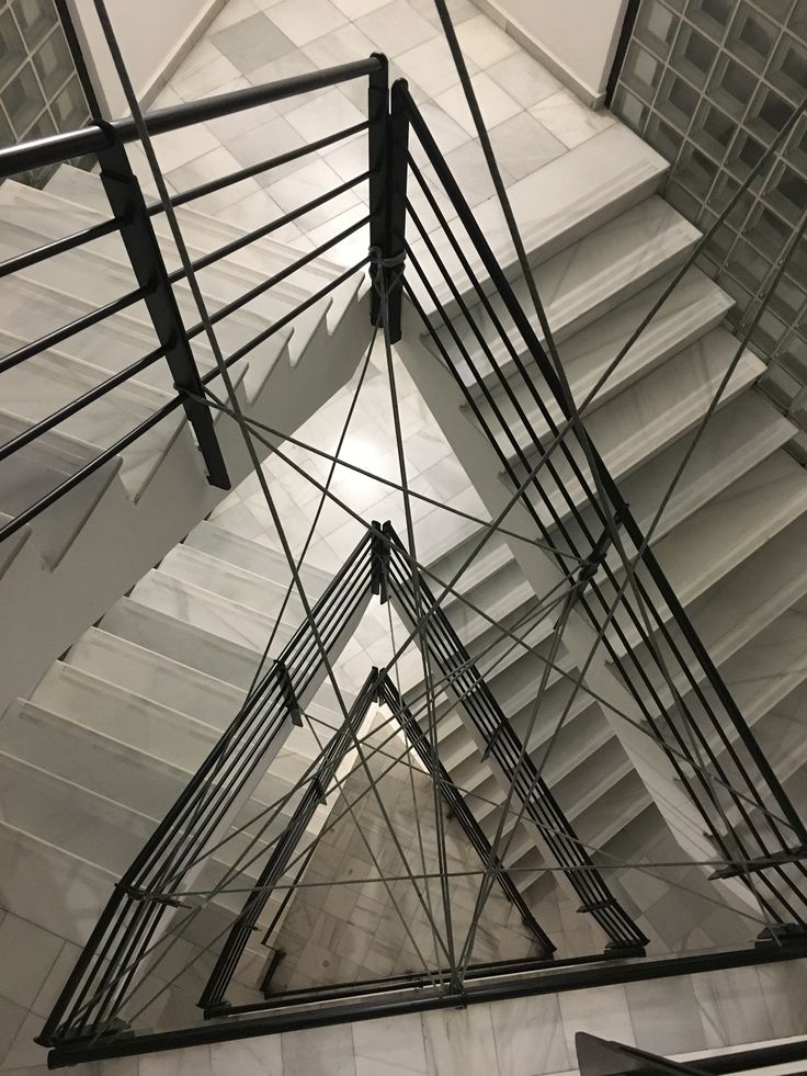 the inside of a building with many wires hanging from it's ceiling