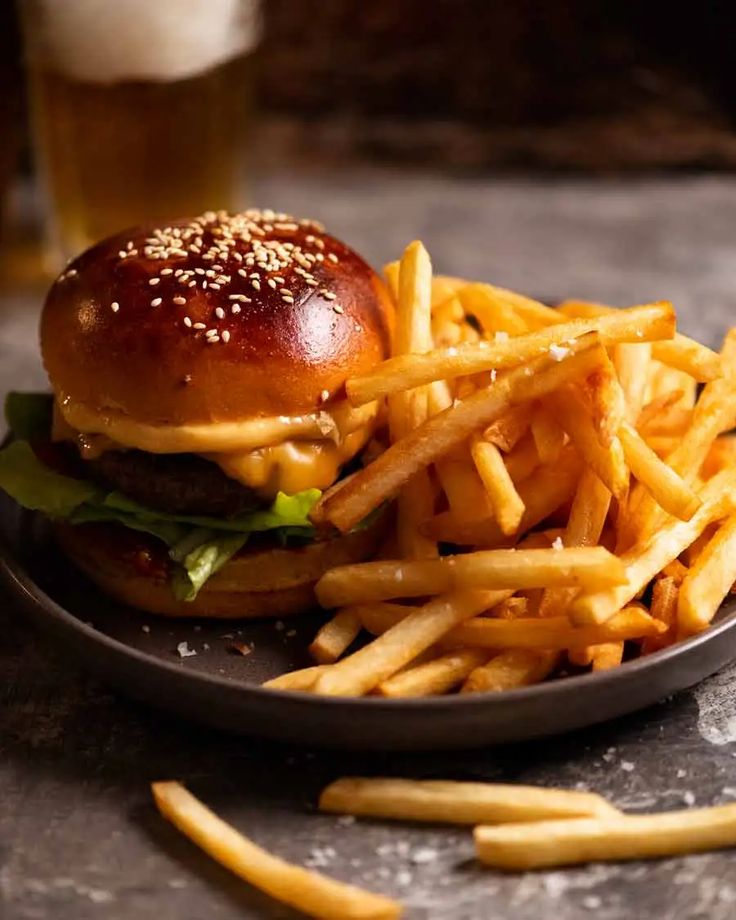 a hamburger and french fries on a plate