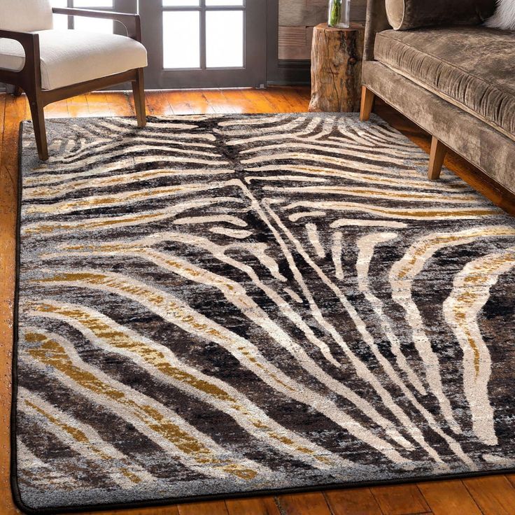 Made in the USA. 100% EnduraStran nylon construction for easy care and durability. Synthetic Loc-Bak backing ensures this rug lays flat and won’t curl. Use of a rug pad is recommended to prevent slippage and movement. 3-ft x 4-ft size is a perfect accent piece for foyers and next to beds. Heat resistant fiber is safe to use in any area of your home. Spot cleans easily with mild detergent/ vacuum regularly to keep it looking like new. Moisture-wicking nylon material resists pet dander and bacteria. 1-year warranty gives you peace of mind. American Dakota 3 X 4 (ft) Rawhide Indoor Animal Print Area Rug in Brown/Tan | 0644RWH234 Golden Zebra, Zebra Print Rug, Zebra Rug, Decor Western, Luxury Floor, Zebra Design, Area Rug Runners, Custom Made Furniture, Western Decor