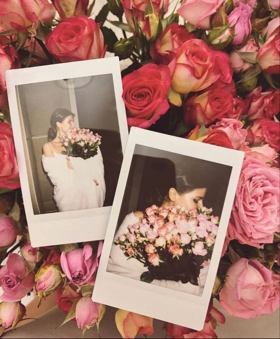 two polaroid frames with flowers in them on a bed of pink and orange roses