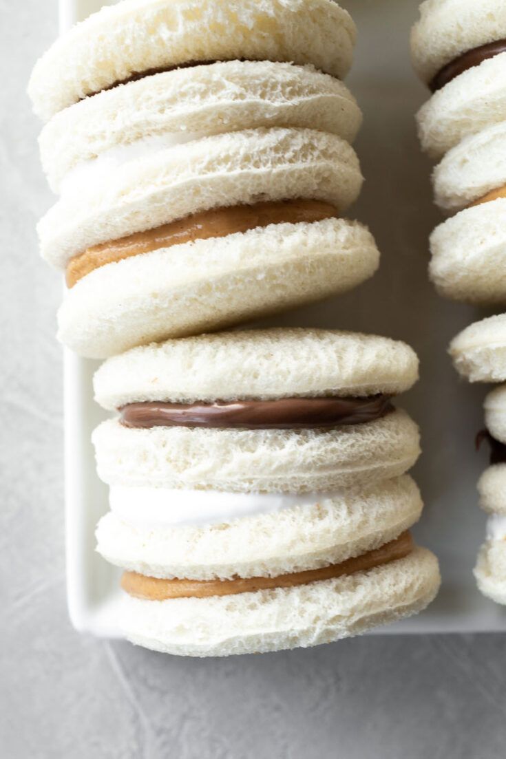 a white plate topped with donuts covered in frosting