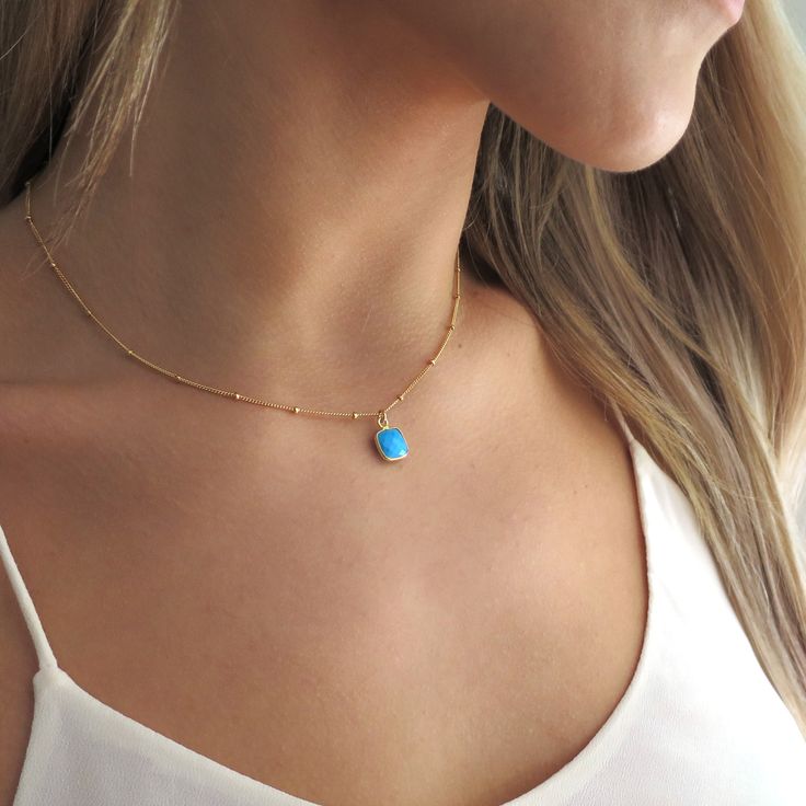 "This dainty little turquoise pendant is faceted and hung on a 14k gold filled chain. It's a perfect gift for any turquoise lover! They make a great layering piece, but also looks perfect by itself! Shop Landon Lacey Jewelry » www.etsy.com/shop/landonlacey it's in the DETAILS . . . » 14k gold filled chain » Turquoise, 9x9mm » Spring ring clasp it's in the OPTIONS . . . » Select your length at checkout. The model is wearing this necklace at 16\", she is petite and this may sit shorter or longer d Dainty Yellow Gold Turquoise Necklace For Gift, Dainty Turquoise Pendant Necklace, Blue Turquoise Necklace With Delicate Chain, Dainty Blue Turquoise Pendant Necklace, Delicate Gold Necklace, Jewelry Delicate, Necklace Turquoise, Pendant Gold, Organza Gift Bags