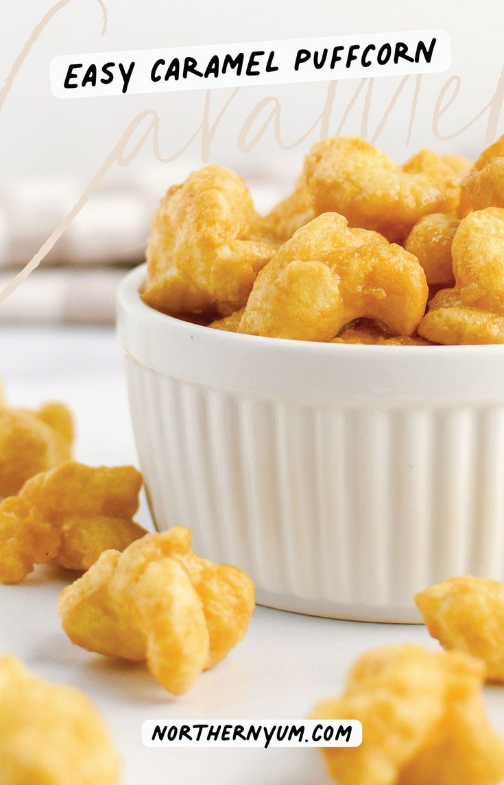 a white bowl filled with caramel puffcrumbs on top of a table