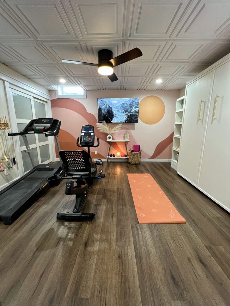 a home gym with treadmills and exercise equipment