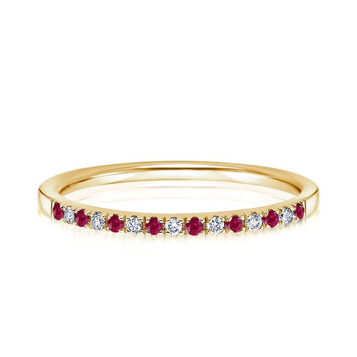 a yellow gold band with red and white stones