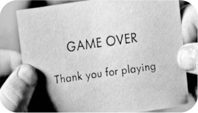 someone holding up a card that says game over thank you for playing in black and white