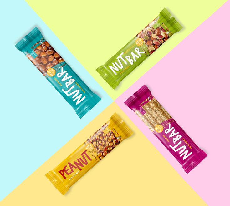 three different types of nut bars on colorful background