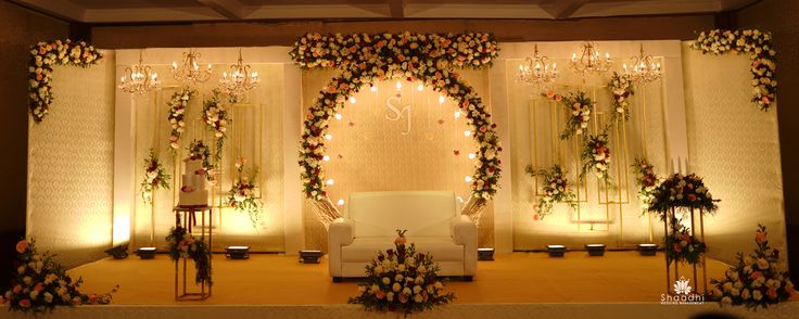 a decorated stage with flowers and candles