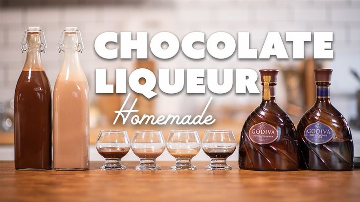 chocolate liqueur and wine glasses sitting on a counter with the words, chocolate liqueur homemade