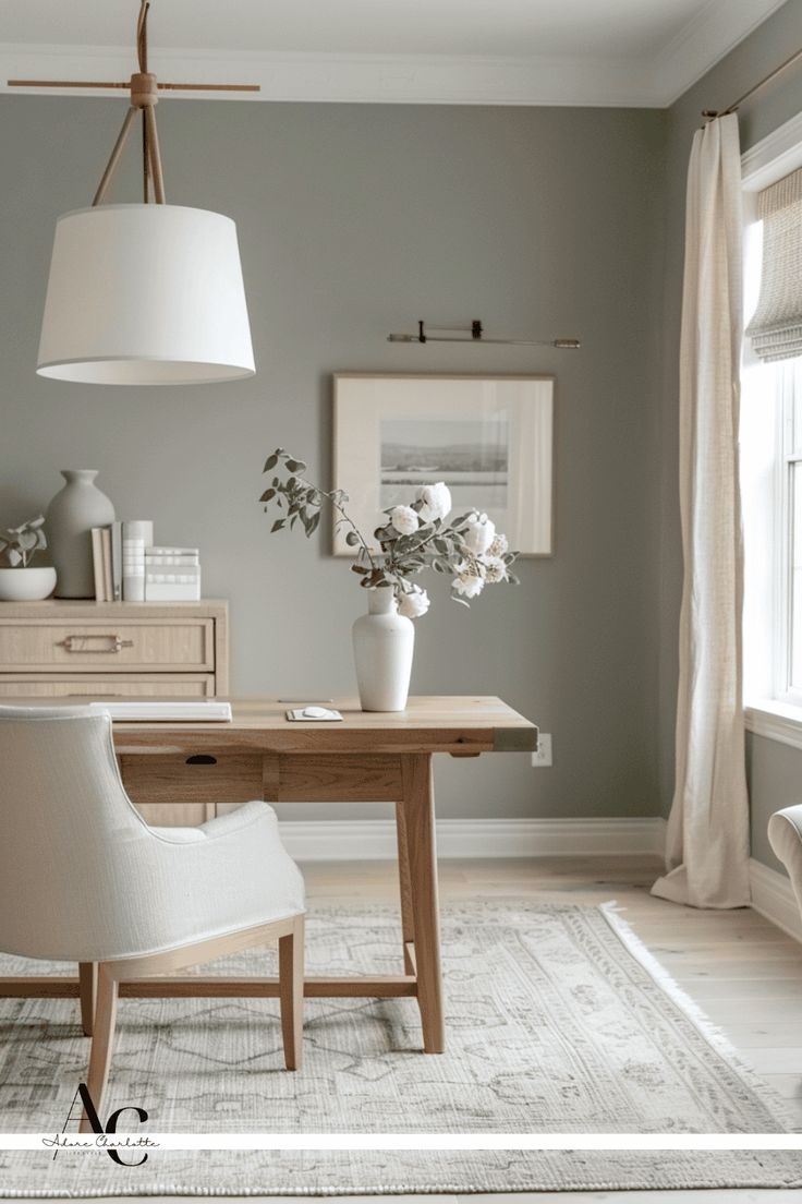 a dining room table with chairs and a vase on it's end next to a window