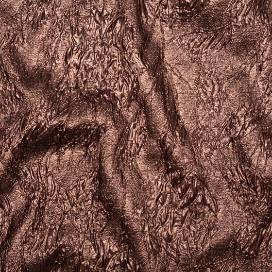 an image of the surface of a cloth that has been drawn with brown ink on it