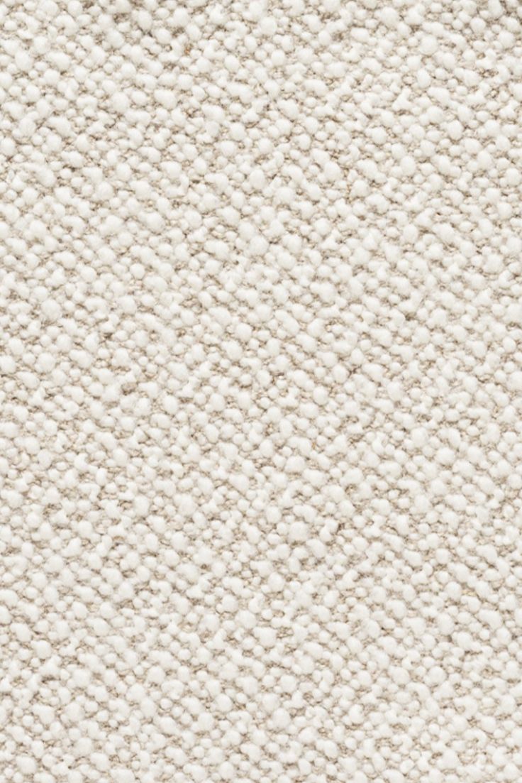 an up close shot of the texture of a white carpet