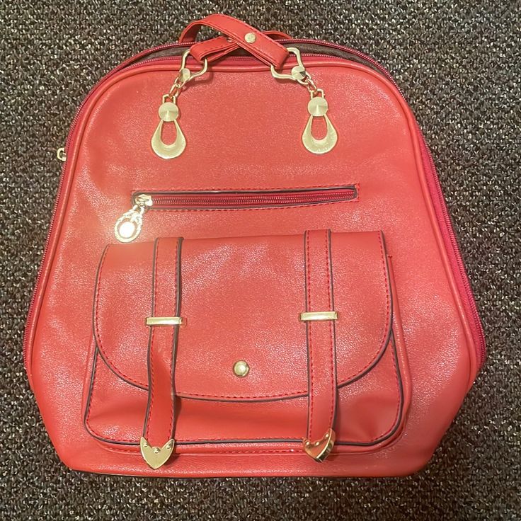 Red Leather Bag. Has Straps For The Back So You Can Wear As A Book Bag. Has 8 Compartments To Place Things. Fairly New. Never Been Worn. Would Love To Find A Nice Home For It Large Capacity Red Satchel For School, Red Satchel With Mobile Phone Bag For Shopping, Trendy Red Pouch Bag, Red Crossbody Travel Backpack, Red Crossbody Backpack For Travel, Trendy Red Satchel With Zipper Closure, Trendy Red Shoulder Bag For School, Red Satchel With Zipper Closure For School, Red Satchel Shoulder Bag For School