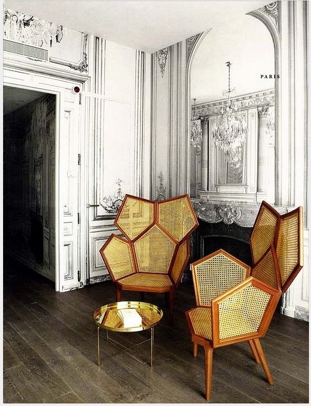 three wicker chairs sitting on top of a hard wood floor