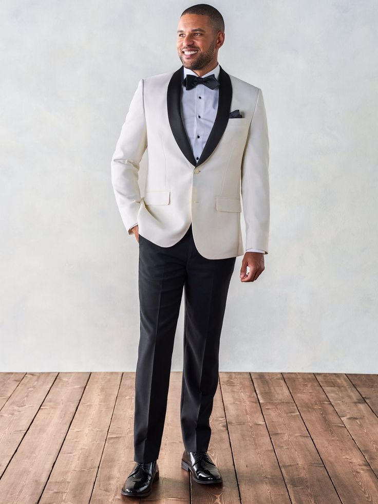 The white dinner jacket with black lapels is a classic look. Originally a warm weather alternative to the black tuxedo, these days a contrast shawl tux keeps its cool in any climate. Includes jacket and pants. Pants are available in classic and slim fits. 100% super-fine Italian merino wool Two-button closure Silk gros Fitted Tuxedo Style Outerwear, Elegant Tailored Outerwear For Black Tie Event, Elegant Single Breasted Outerwear For Black-tie Events, Elegant Single-breasted Outerwear For Black-tie Events, Fitted Tuxedo For Winter Black-tie Events, Winter Black Tie Tuxedo With Notch Lapel, Fitted Outerwear With Suit Collar For Black Tie Event, Winter Black-tie Event Suits With Suit Collar, Tailored Tuxedo For Black-tie Winter Events