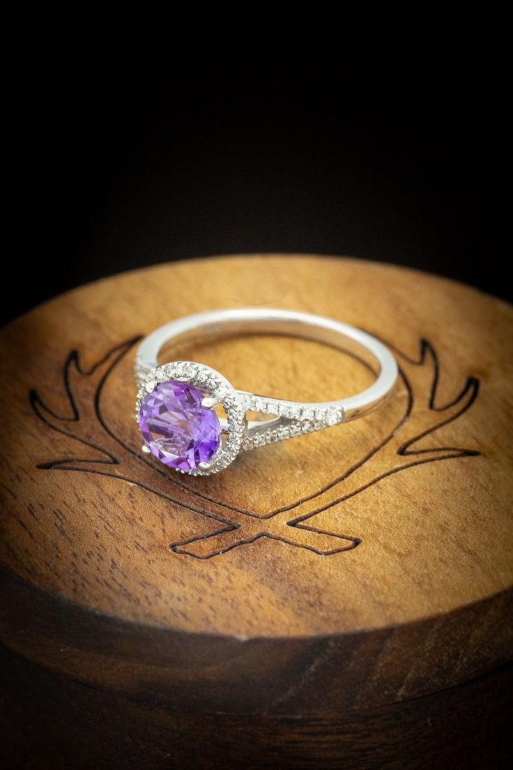 Product Details Ring Style:The "Aura" is a birthstone ring with a split shank-style Amethyst women's ring with delicate and ornate details and is available with many center stone options Center Stone:7mm RoundAmethyst Materials: 14K gold engagement ring featuring an amethyst center stone and a 1/5 ctw diamond halo and accents. Customizable:Because each of our rings is handcrafted to order, wecan customize yours using unique materials, gemstones, or design features. Contact us to make your ring e Amethyst Gemstones With Center Stone, Round Cut, Fine Jewelry Amethyst Promise Ring With Center Stone, Fine Jewelry Amethyst Ring With Center Stone For Promise, Amethyst Jewelry With Accent Stones In Round Band, Heirloom Purple Birthstone Jewelry, Round Amethyst Halo Ring For Gift, Gift Halo Amethyst Ring, Heirloom Amethyst Ring With Round Cut Center Stone, Heirloom Amethyst Ring With Round Cut