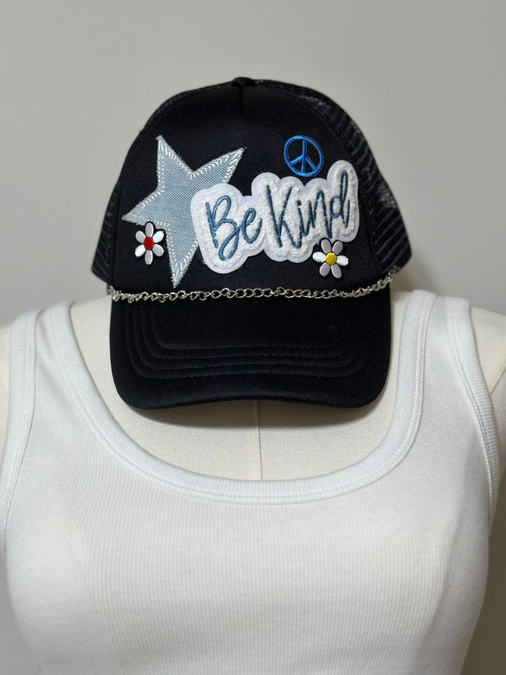 Want to add a fun accessory to your outfit to show off your personality and style, or just having a bad hair day, The Bleached Gnome has got you covered with our patch-design trucker hats.  Featuring an array of vibrant, fun patches, and silver chain, our hats make the perfect-throw-on-and-go accessory.   Color: Black  Sizing: Adult one size fits most with adjustable back  Hats are FINAL sale **Chain is removable** Casual Baseball Cap With Patches For Summer, Casual Summer Baseball Cap With Patches, One Size Fits Most Trucker Hat With Patches, Trendy Embroidered Snapback Hat For Summer, Trendy Snapback Hats For Festival, Casual Trucker Hat For Music Festival, Trendy Cap For Music Festival, Trendy Summer Snapback Hat With Embroidered Patch, Casual Adjustable Hats With Patches