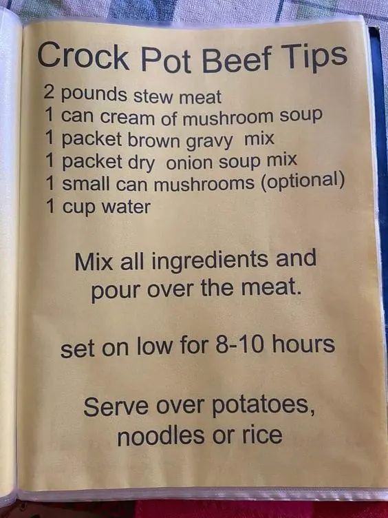 an open recipe book with instructions for how to make crock pot beef tips on it