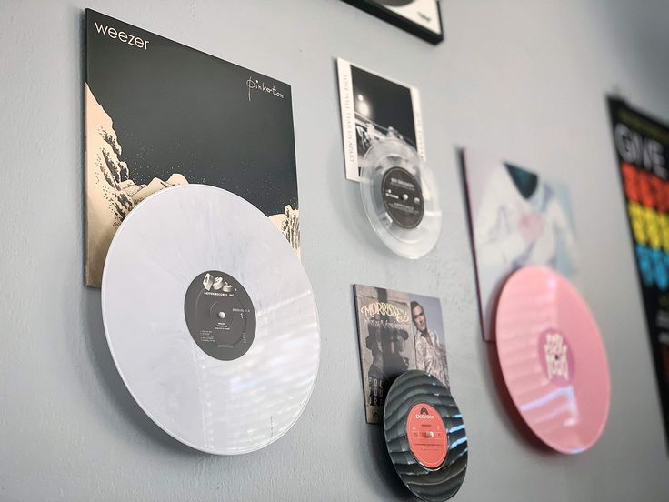 there are several different records on the wall