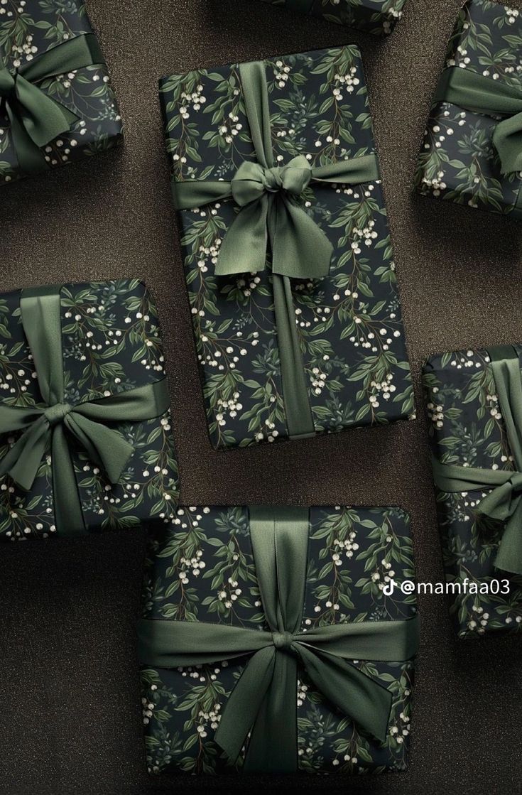 several wrapped presents with green bows and flowers on them, all tied up in different patterns