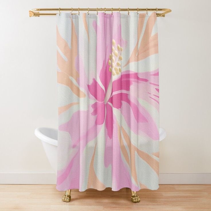 a pink and white flower shower curtain hanging on a wall