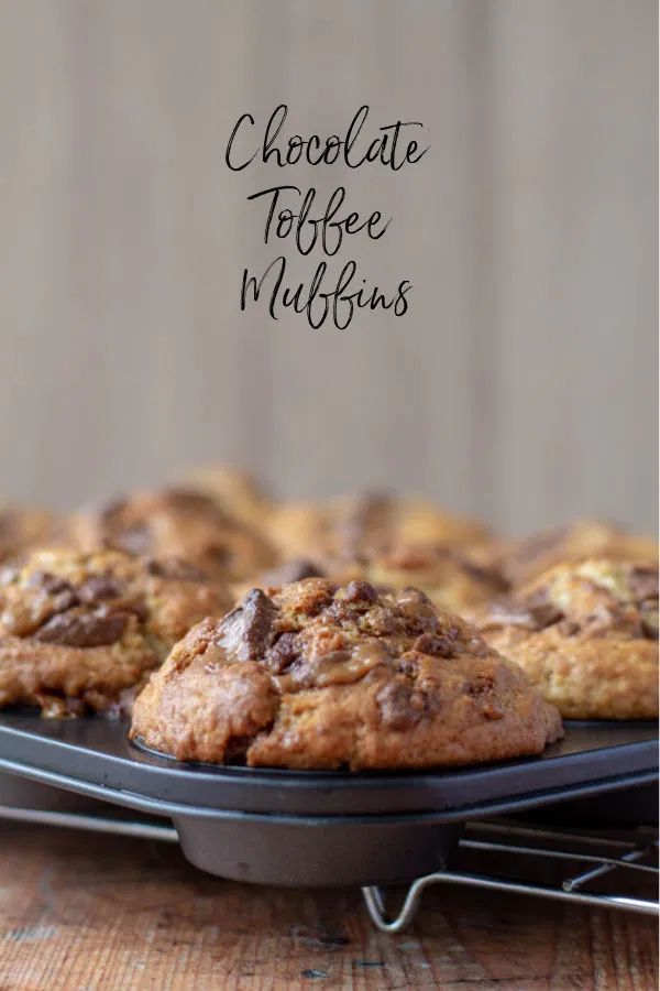 chocolate toffe muffins on a cooling rack with the words chocolate toffe muffins