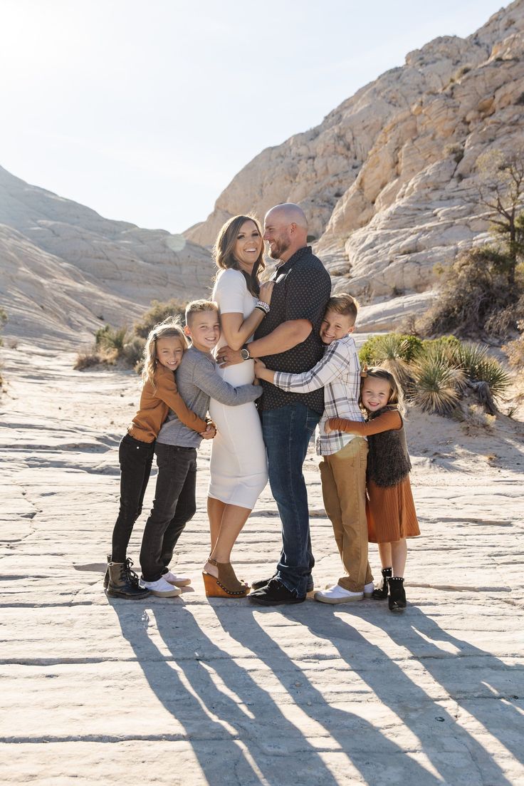 a family posing for a photo in the desert