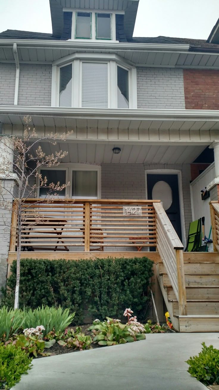 a house with stairs leading up to the front door