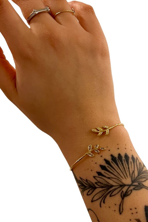 Arm candy is always a plus. The Leafy Gems is the perfect little cuff to pair with any look & makes a great gift for a special someone! Elegant Resizable Cuff Bracelet As Gift, Spring Bangle Jewelry Gift, Trendy Everyday Cuff Bangle Bracelet, Trendy Adjustable Cuff Bracelet For Party, Trendy Spring Bracelets For Party, Chic Adjustable Bracelet As A Gift, Chic Adjustable Bracelets As Gift, Spring Gift Bangle Jewelry, Chic Adjustable Bracelet For Gifts