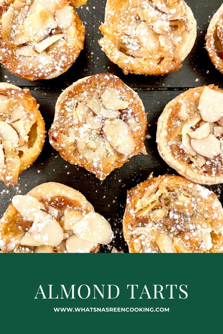 almond tarts with powdered sugar on top and the words almond tarts above it