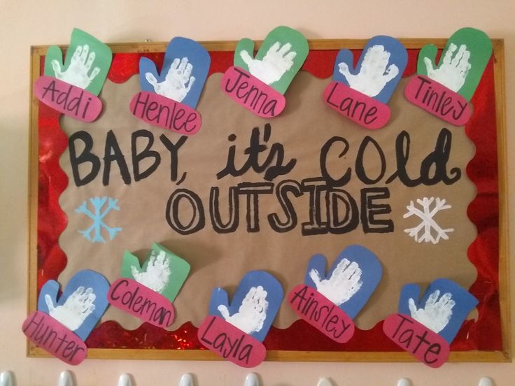 a baby it's cold outside bulletin board with handprints and magnets