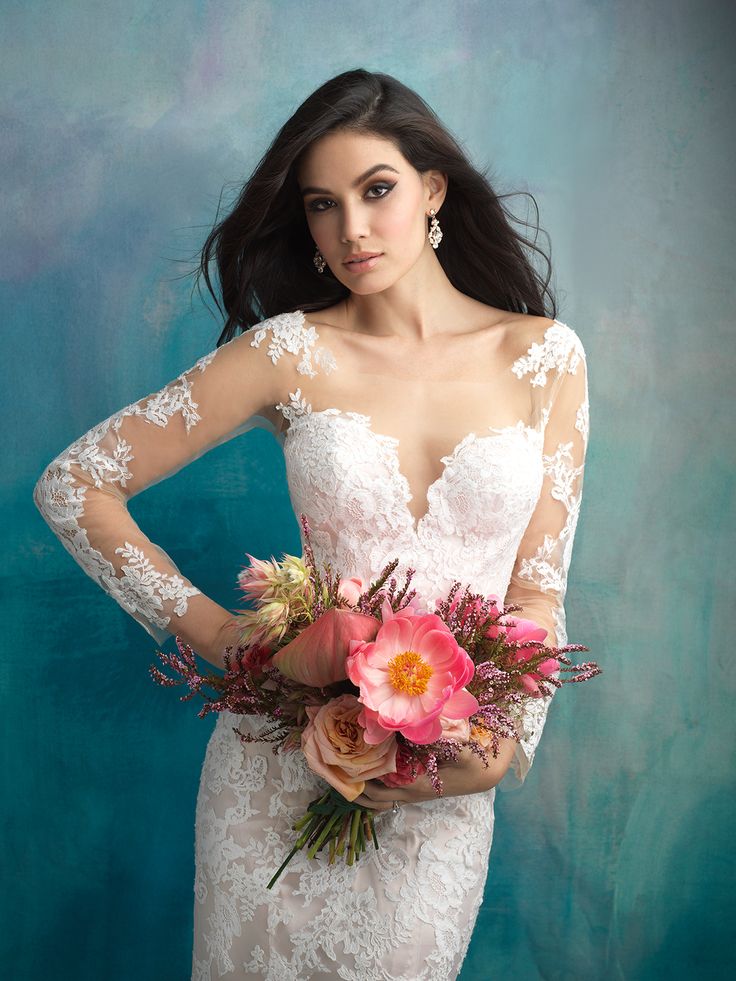 a woman in a wedding dress holding a bouquet