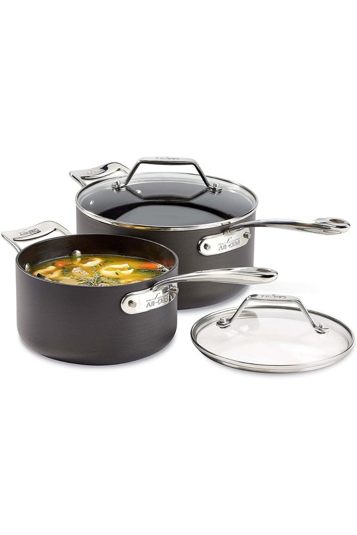 three pots and pans with lids sitting on top of each other in front of a white background