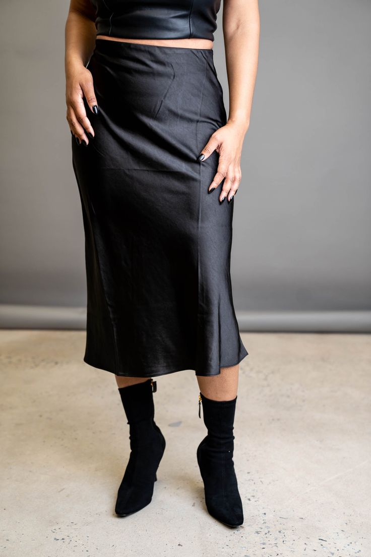 A slip skirt is a wardrobe must-have. This classic is the perfect wardrobe essential that can go from day to night depending on your vibe. Wear it with heels for the perfect date night look, or wear it with sneakers to transition it to the perfect errand skirt. FEATURES Zipper side closure Elastic waist Light stretch SIZE & FIT Model is wearing a size: Small. True to size. DETAILS 100% Polyester CARE Hand wash cold. Do not bleach. Line dry. Iron low. Sleek Summer Night-out Skirt, Sleek Mini Skirt For Date Night, Sleek Midi Skirt, Sleek Pencil Skirt For Night Out, Fitted Midi Length Bottoms For Night Out, Sleek Midi Skirt Bottoms For Evening, Sleek Fitted Skirt For Night Out, Sleek Relaxed Skirt For Spring, Sleek Relaxed Fit Skirt For Spring