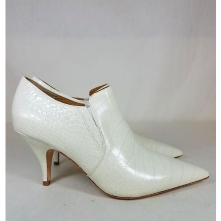 Nwot Tory Burch Georgina Exotic-Print Heeled Booties Sz 8.5 These Elegant Cream Leather Crocodile Effect Booties From Tory Burch Are The Perfect Pair To Add Sophistication To Any Outfit. These Booties Feature A Pointed Toe, Elasticated Side Panels, A Branded Insole And A Mid-Heel. Brand New! 80mm Light Use! Original Retail $398 Bundle & Save! Always Considering Reasonable Offers :) Spring Formal Pointed Toe Booties, White Fitted Almond Toe Heels, White Almond Toe Fitted Heels, White Closed Toe Booties For Party, White Fitted Heels With Reinforced Heel, White Almond Toe Heels, White Low Heel Boots With Reinforced Heel, White High Heel Boots With Padded Heel, Spring Pointed Toe Booties With Sculpted Heel