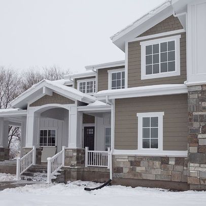 a house in the winter with snow on the ground