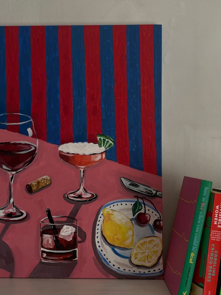 a painting of two glasses of wine on a table next to books and a plate with fruit